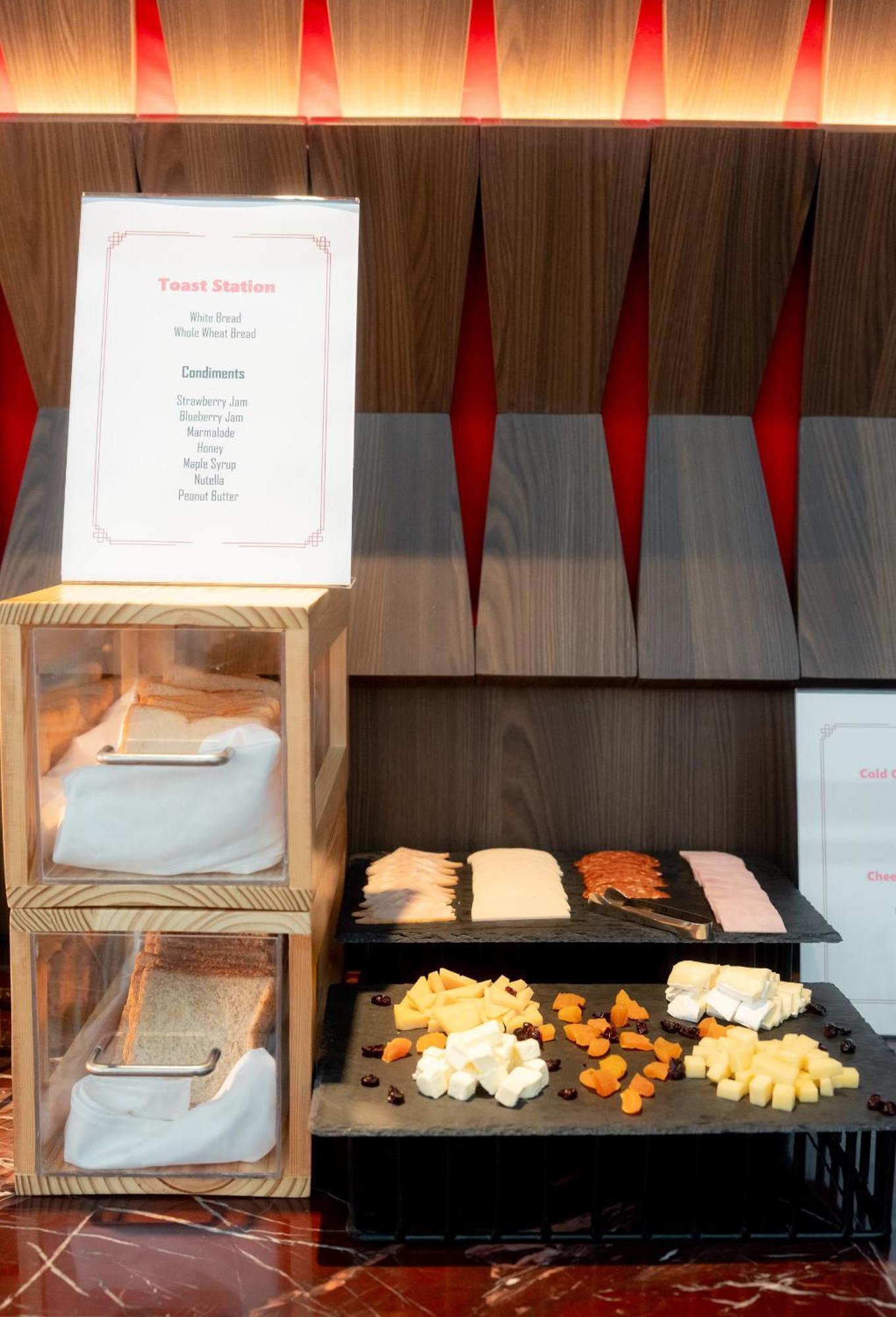 Ascott Embassy Sathorn Bangkok 호텔 외부 사진 A selection of cheese at a buffet
